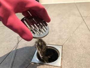 cleaning a clogged shower drain