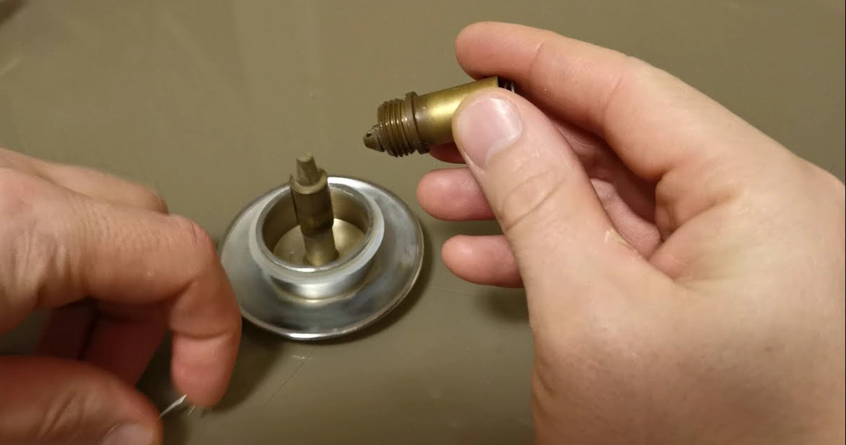 Identifying the shut-off valve under a bathroom sink to manage water flow